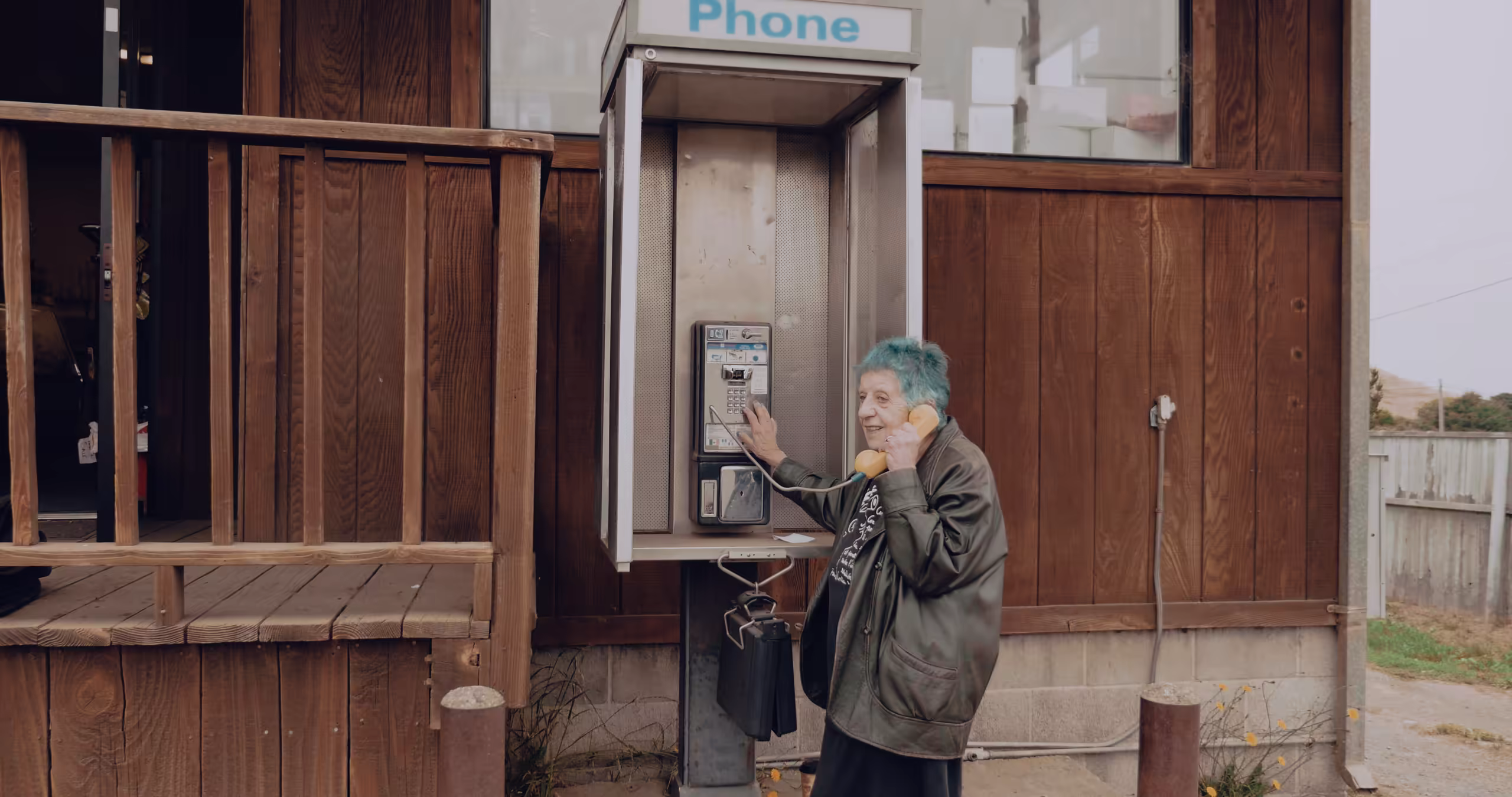 ruth weiss at a phone booth